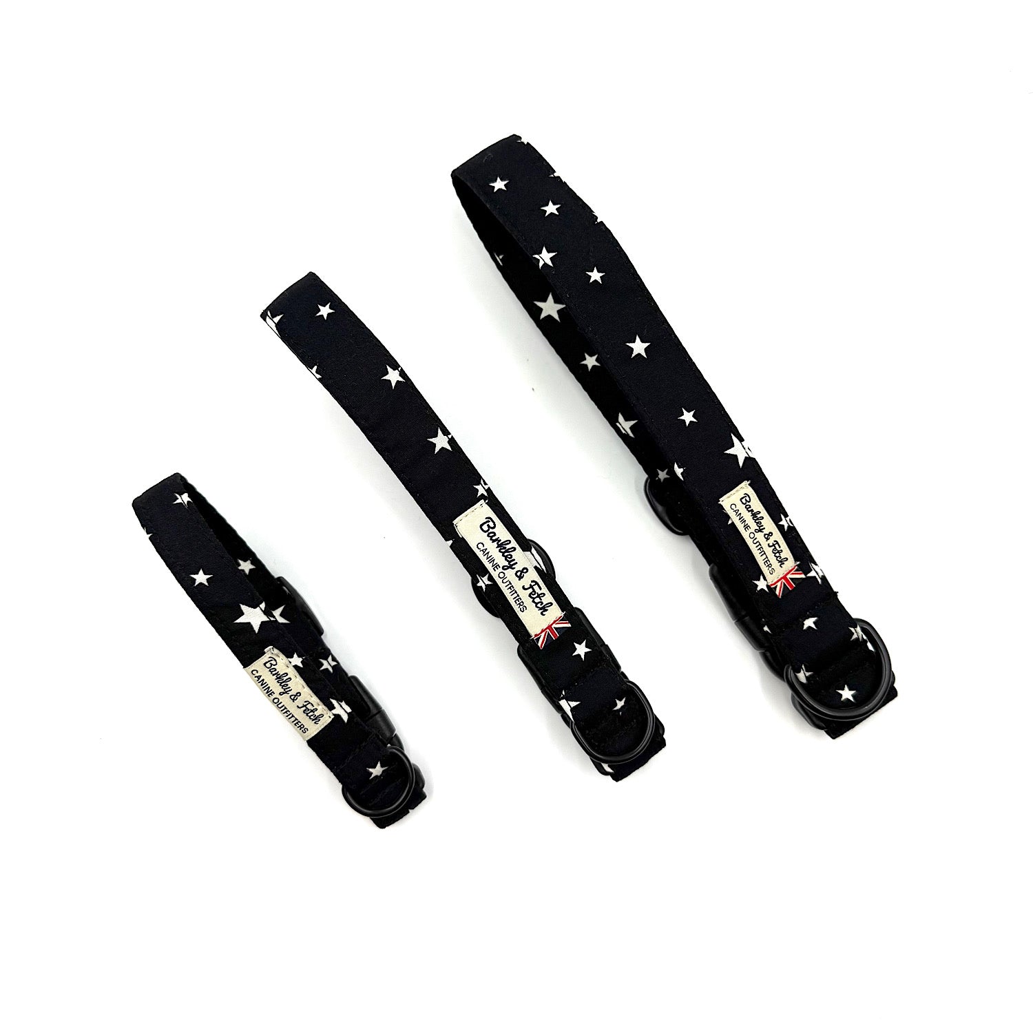 Three black dog collars with star patterns on a white background