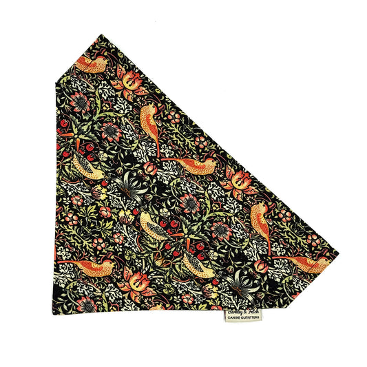 Patterned fabric with birds and flowers on a black background, featuring the brand 'Morris & Co'.