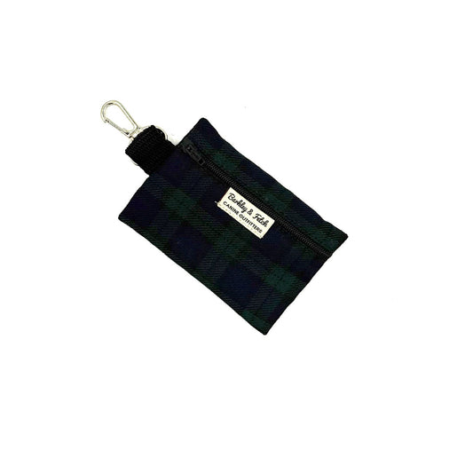Black and green plaid pouch with a metal clip on a white background