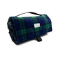 Folded plaid blanket with carrying handle on a white background British handmade by Barkley and Fetch