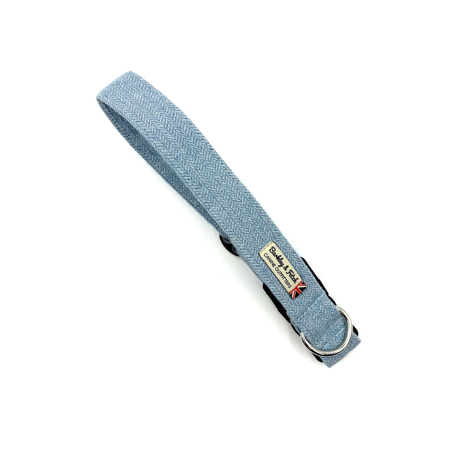 Light blue dog collar with a brand tag on a white background