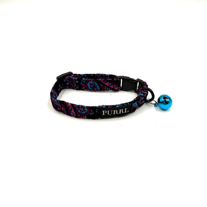 Cat collar with colorful paisley pattern and blue bell on a white background handmade in UK by Barkley And Fetch