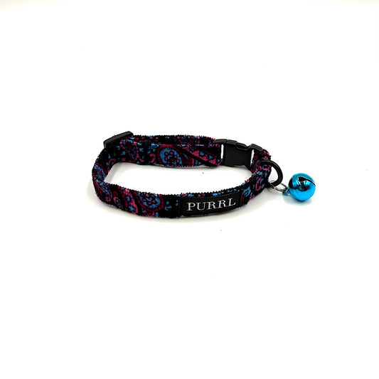 Cat collar with colorful paisley pattern and blue bell on a white background handmade in UK by Barkley And Fetch