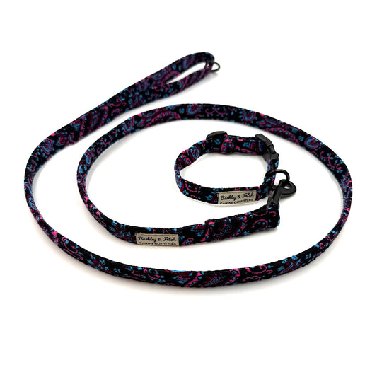 Dog leash and collar set with colorful pattern on a white background