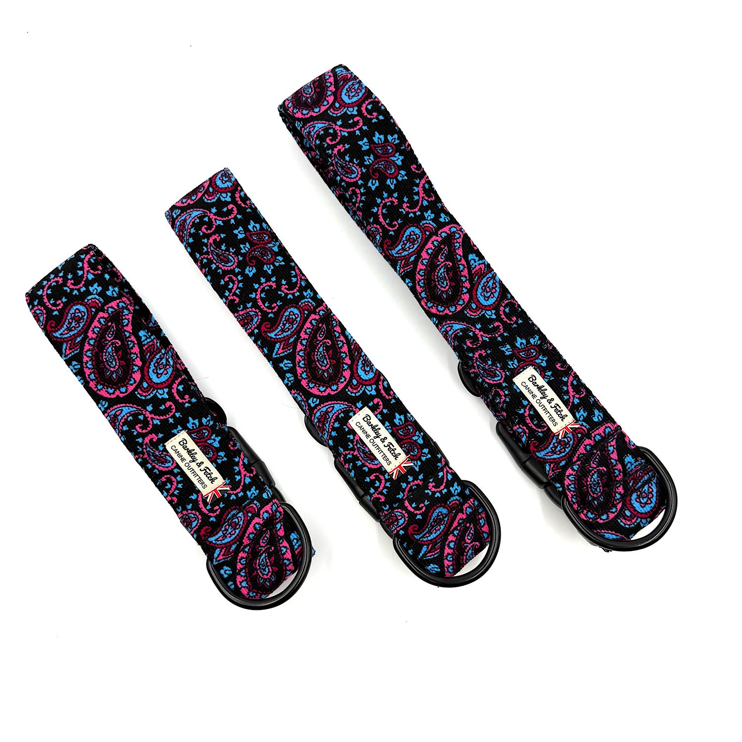 Three paisley-patterned straps with black buckles on a white background