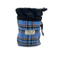 Blue plaid dog training pouch with black top and carabiner on a white background