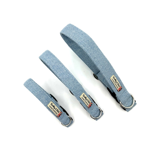 Three blue dog collars with visible branding on a white background