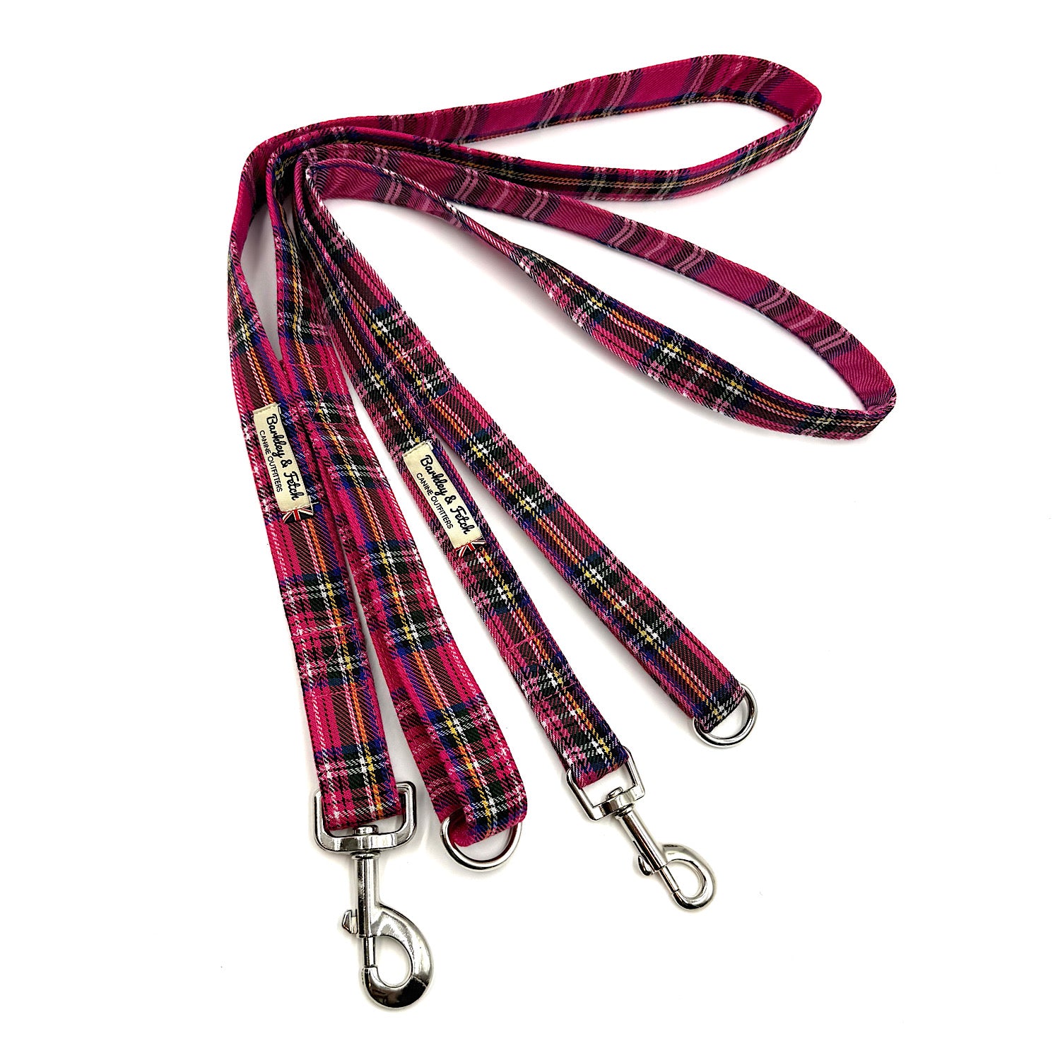 Plaid dog leash with metal clips on a white background