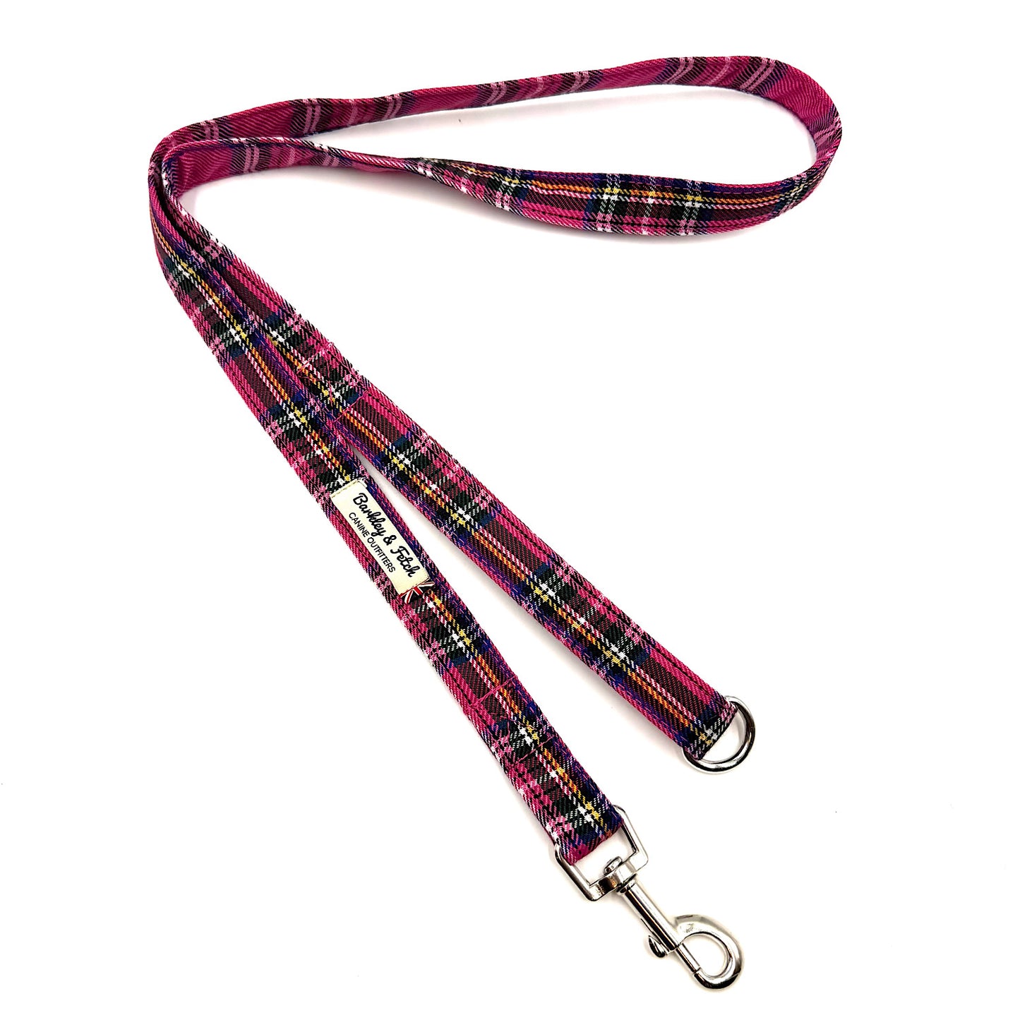 Plaid dog leash with a metal clip on a white background