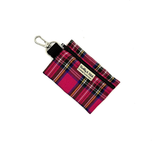 Plaid keychain pouch with a visible brand label on a white background