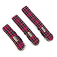 Three plaid dog collars with metal buckles on a white background