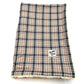 A caramel tartan dog blanket with sherpa backing on a white background handmade by Barkley and Fetch of Great Britain