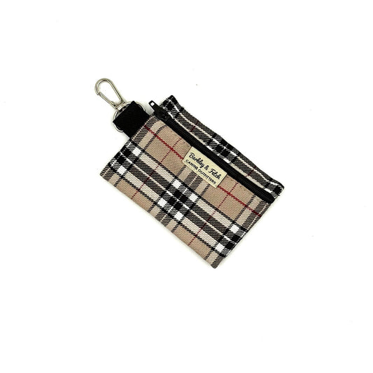 Plaid patterned pouch with a key ring on a white background