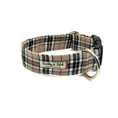 A wide dog collar with a plaid pattern, featuring a strong polyester webbing, secure clip fastening, and a heavy-duty d-ring.