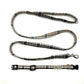 Plaid dog leash with a clip on a white background