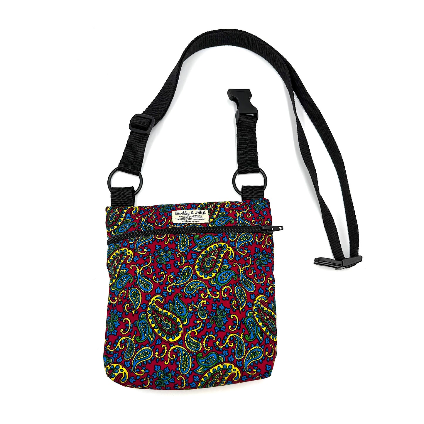 Colorful paisley-patterned bag with a black strap on a white background HANDMADE IN UK BY BARKLEY AND FETCH