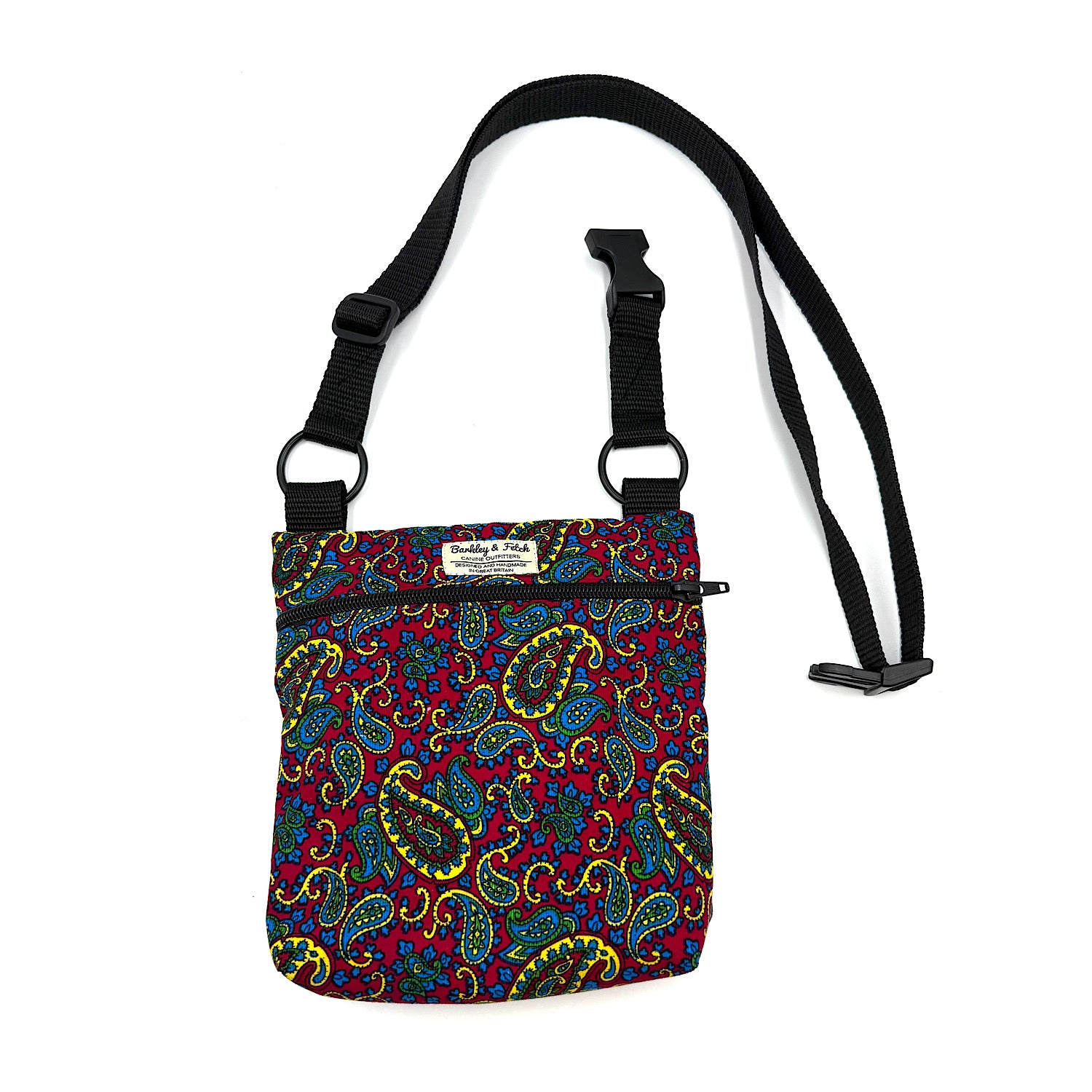 Colorful paisley-patterned bag with a black strap on a white background HANDMADE IN UK BY BARKLEY AND FETCH