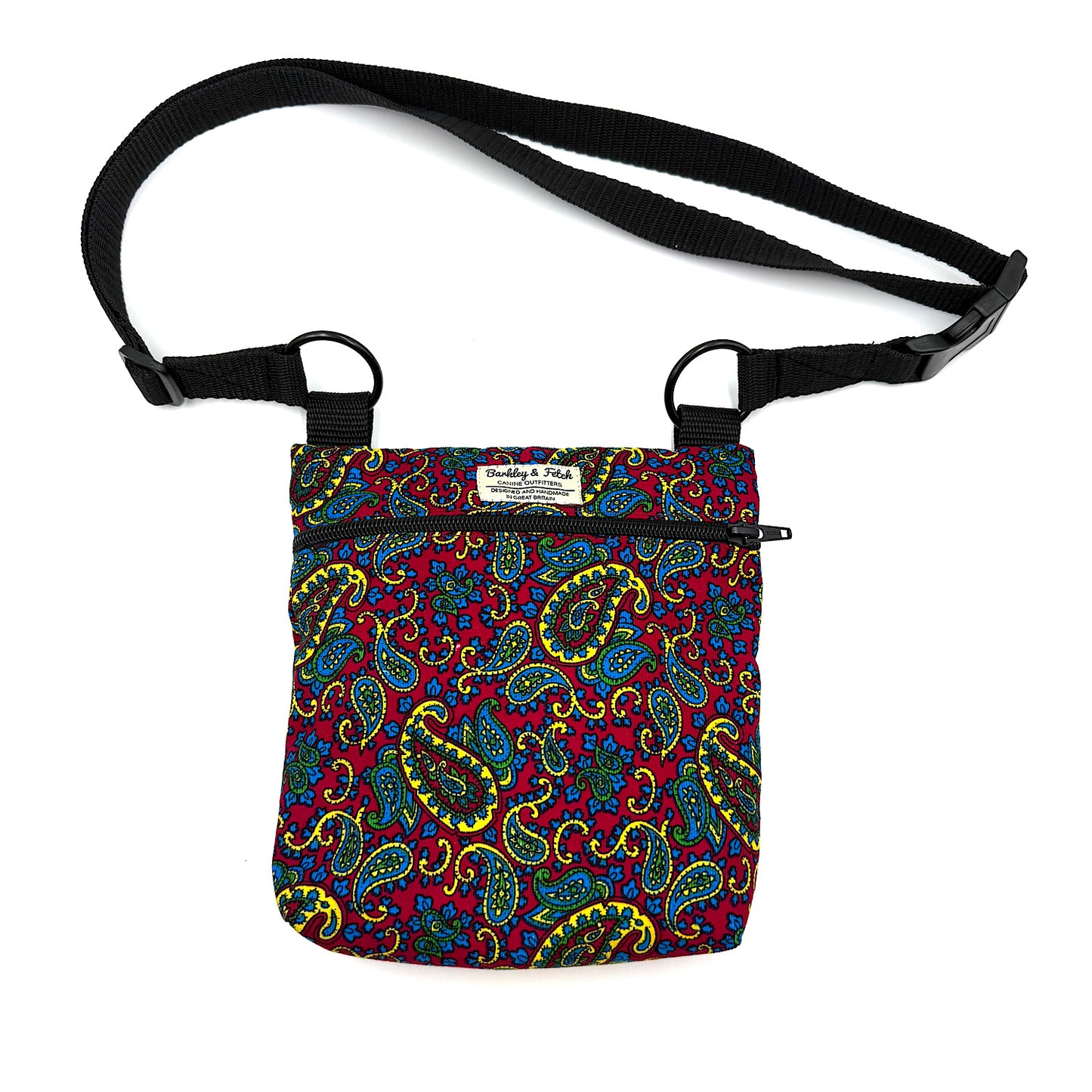 Multicolored paisley-patterned bag with a black strap on a white background HANDMADE IN UK BY BARKLEY AND FETCH