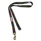 Colorful patterned dog leash with brass clip on a white background