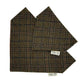 A pair of folded tweed dog bandanas in a brown, green, and orange plaid pattern, displayed on a clean white background. Each one features a small white brand label reading 'Barkley and Fetch Handmade in Great Britain by Barkley and Fetch.