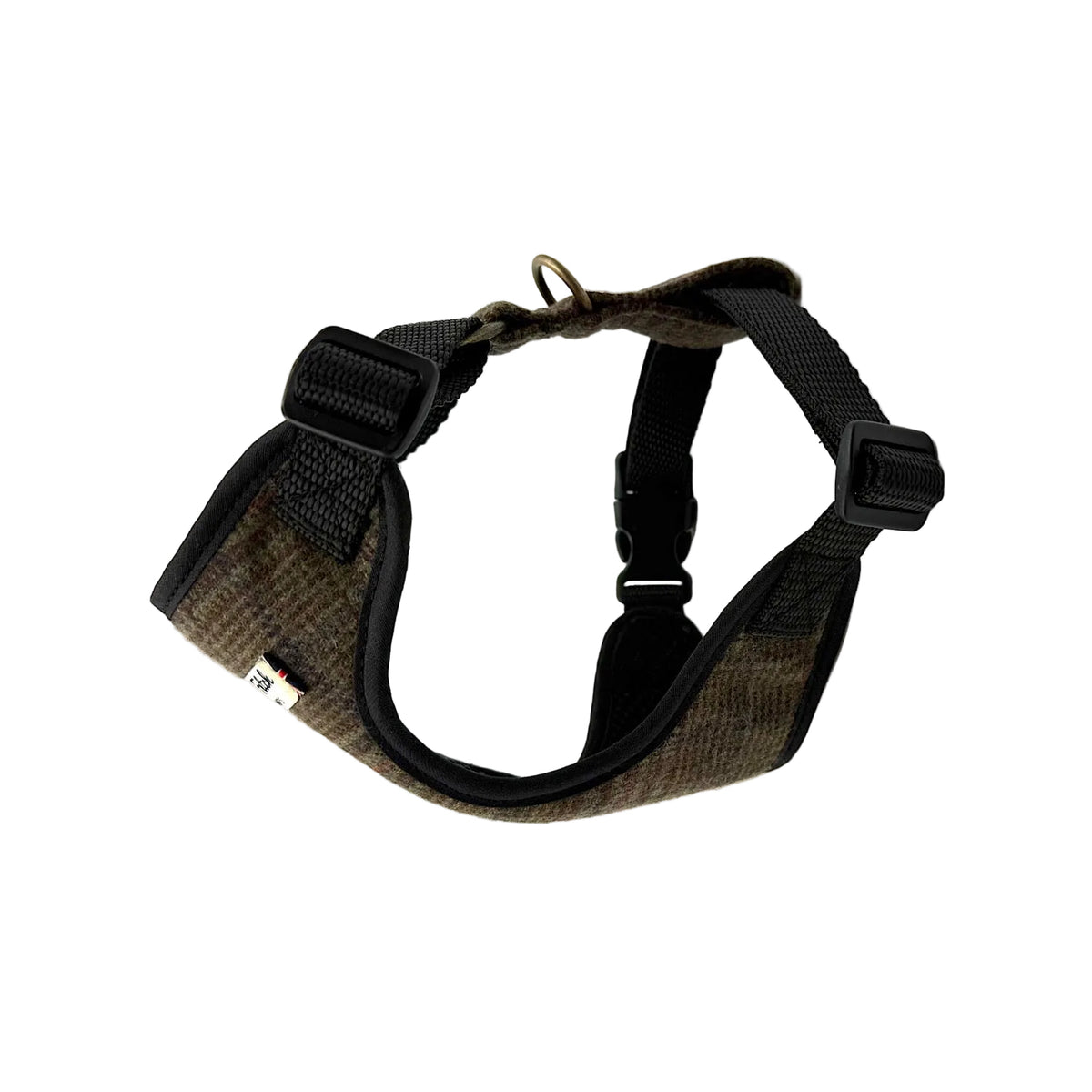 A dog harness with a brown and black houndstooth patterned fabric body and black nylon straps, buckles, and a metal ring, shown on a plain white background. Handmade in Great Britain by Barkley and Fetch.