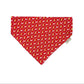 Red bandana with yellow dog pattern on a white background