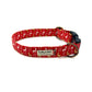 A red dog collar with a white and gold Christmas reindeer print, featuring a secure clip fastening and a welded heavy duty d-ring. handmade in uk by Barkley and Fetch
