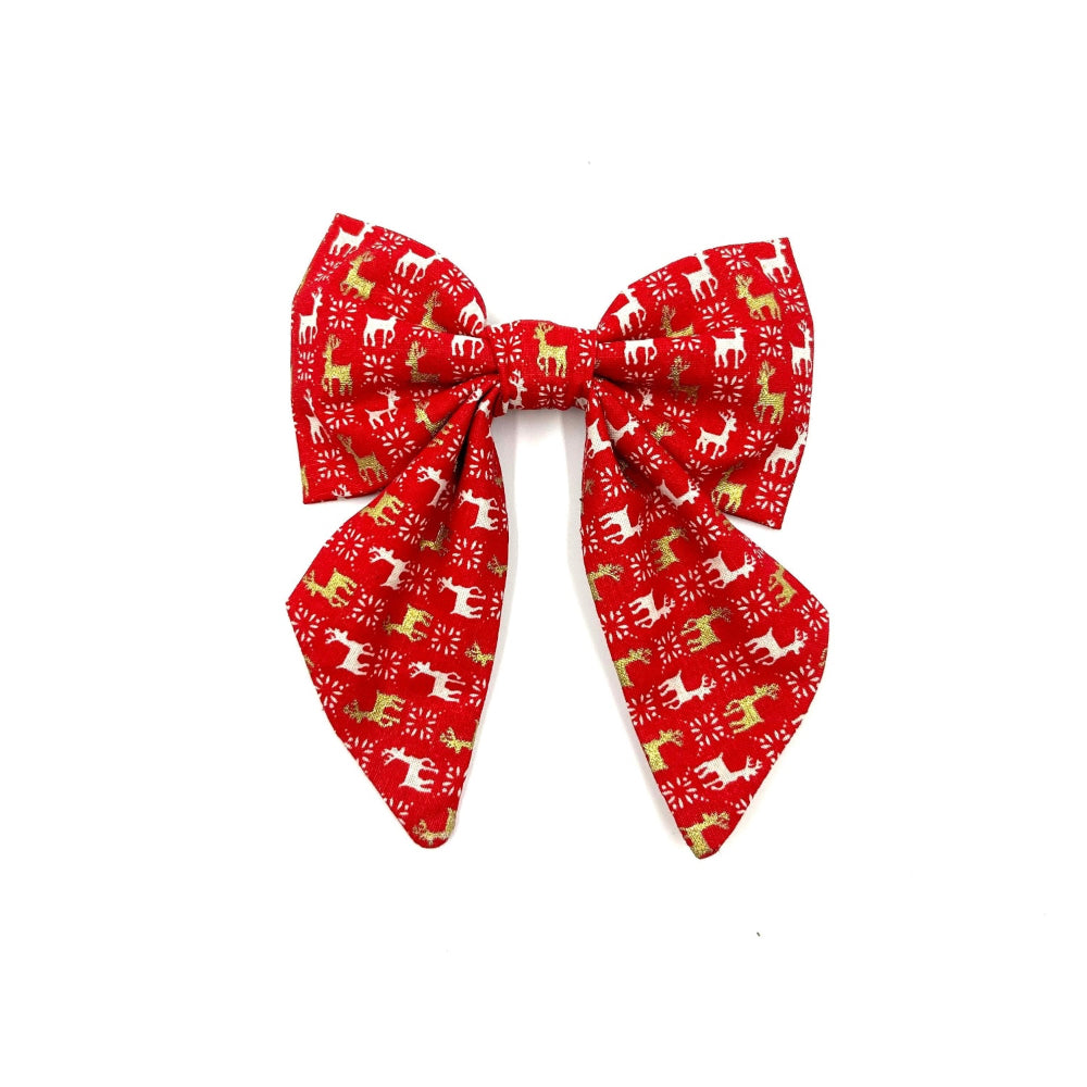 A red and white Christmas-themed dog sailor bow with reindeer patterns handmade in uk by Barkley and Fetch