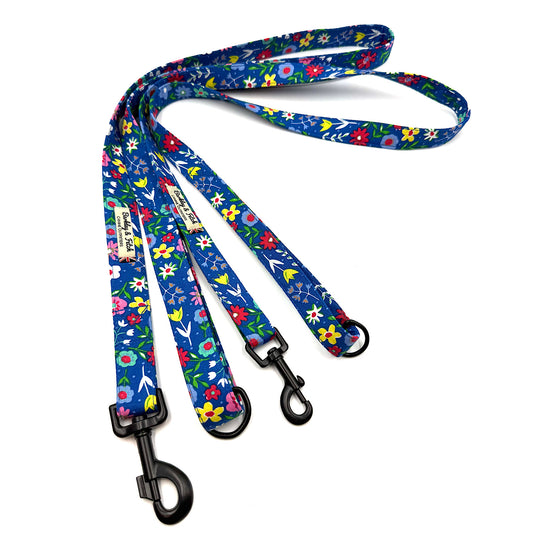 Floral-patterned dog leash on a white background