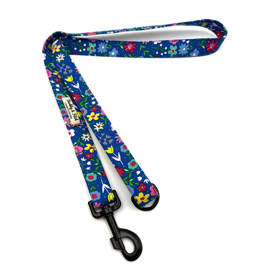 Floral-patterned dog leash on a white background