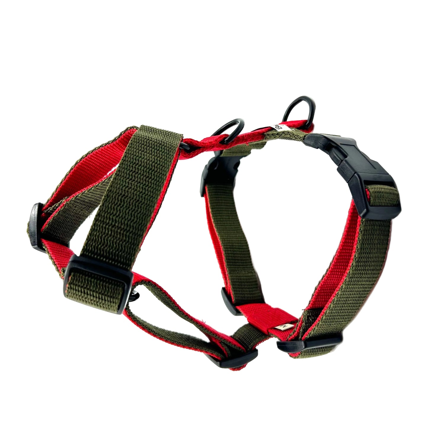 Dog harness with red and green straps on a white background handmade in the UK by Barkley And Fetch
