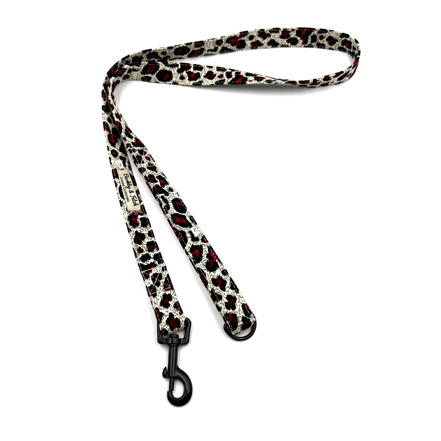Leopard print dog leash with a black clip on a white background