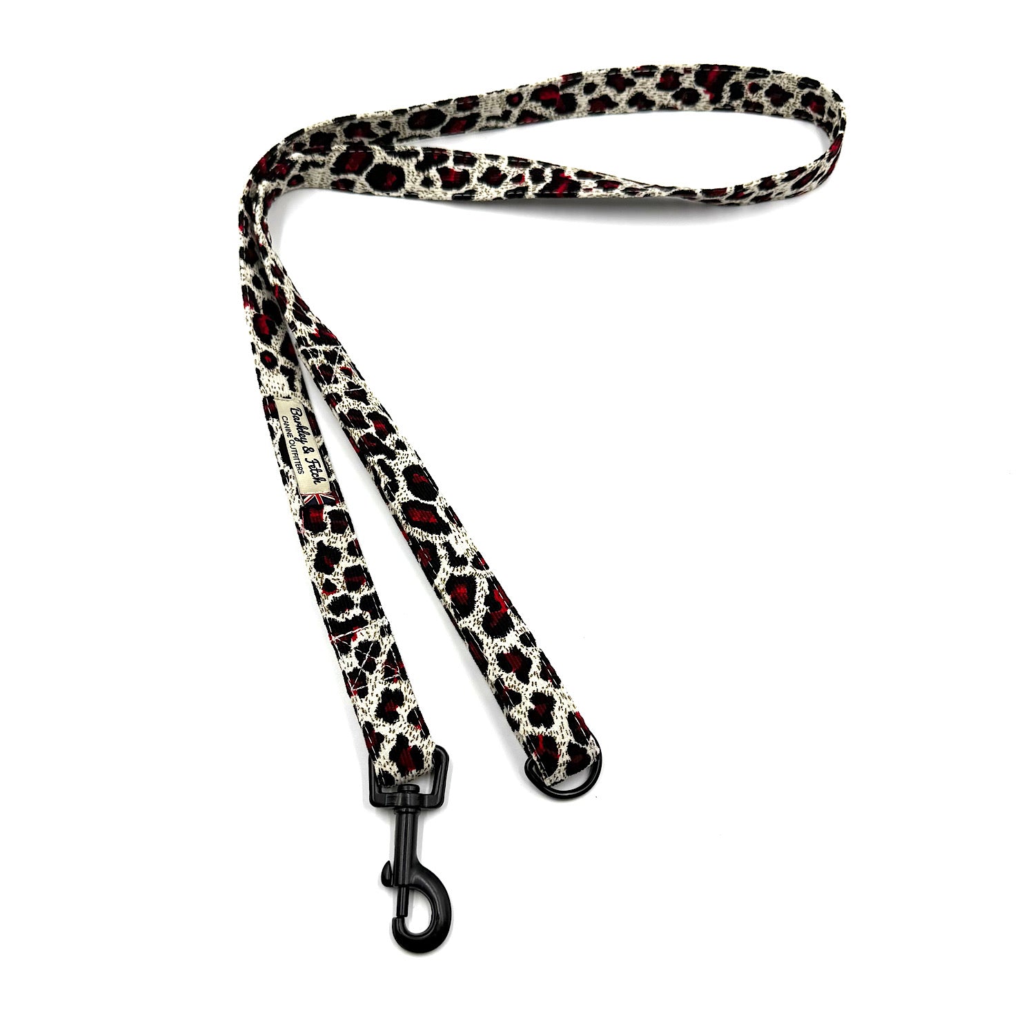 Leopard print dog leash with a black clip on a white background