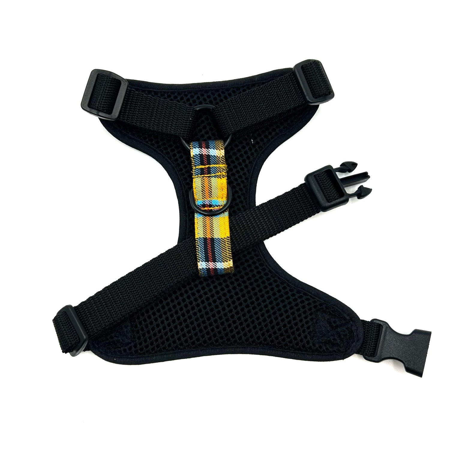 Black dog harness with plaid strap on a white background
