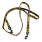 Plaid dog leash with black clip on a white background