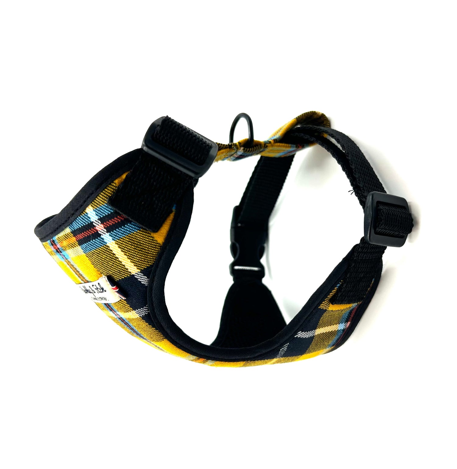 Plaid dog harness with black straps on a white background