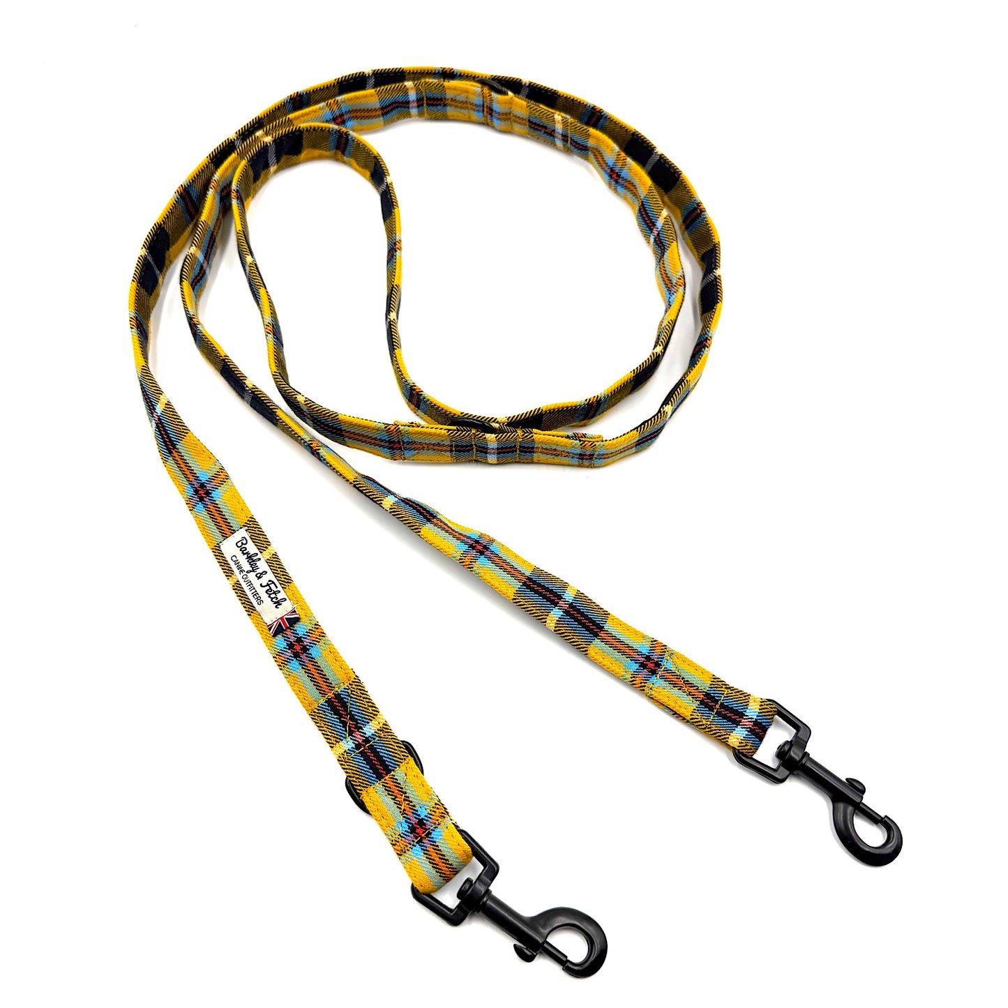 Plaid patterned dog leash with black metal clip on a white background