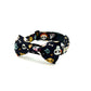Dog collar with skull and crossbones pattern on a white background