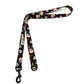 Dog leash with colorful skull pattern on a white background