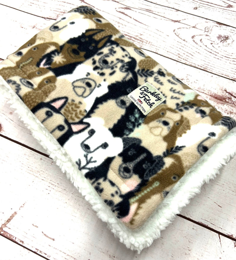 Flannel blanket with animal pattern on a wooden surface handmade by Barkley and Fetch UK