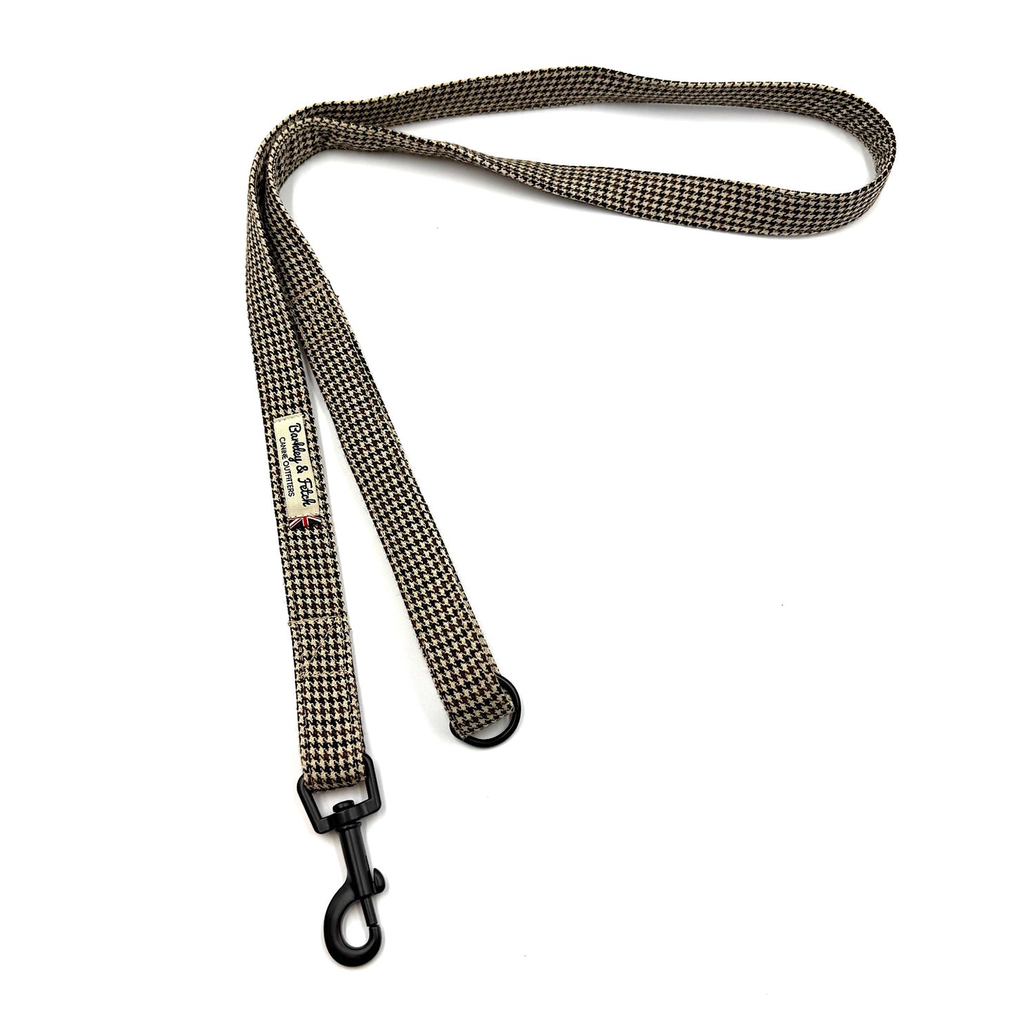 Dog leash with checkered pattern and black clip on a white background
