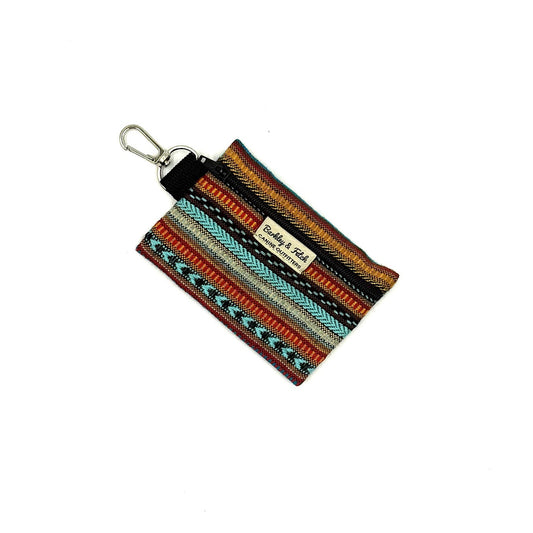Multicolored fabric keychain with a visible brand label on a white background