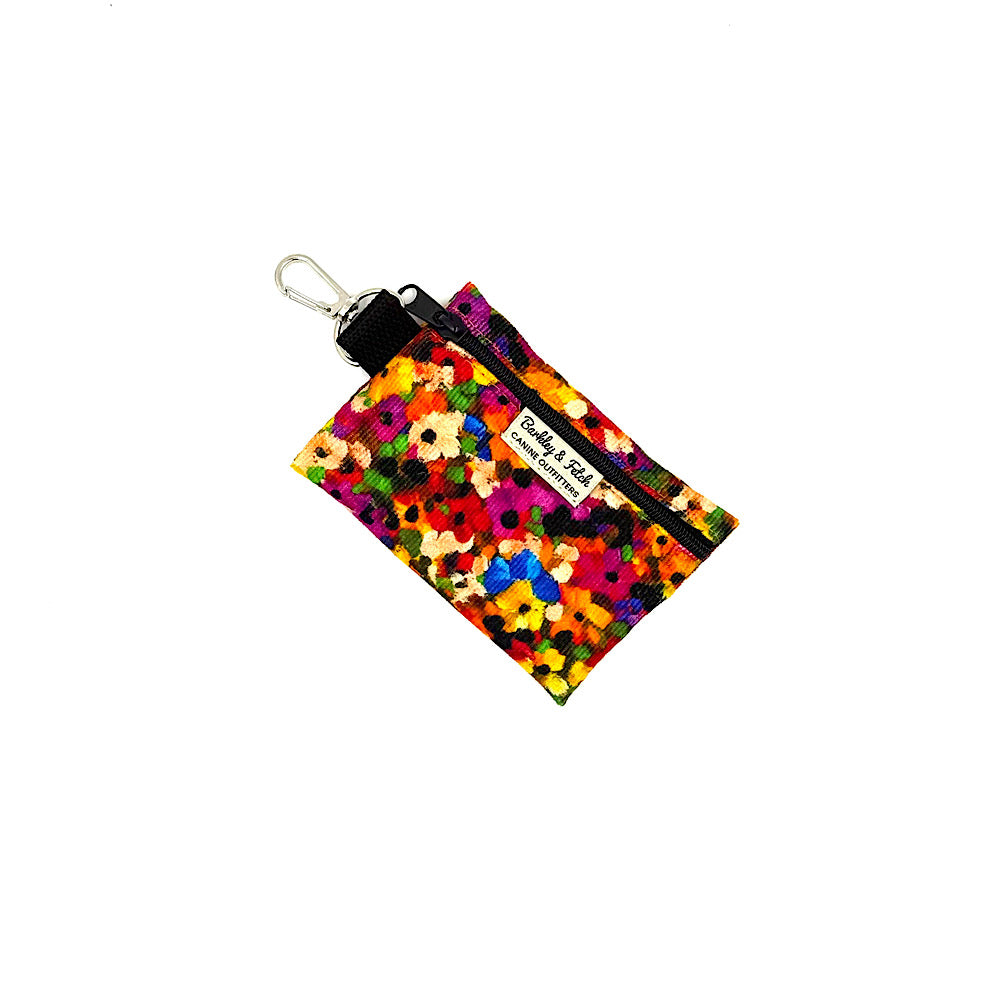 Colorful floral-patterned pouch with a key ring on a white background handmade by Barkley And Fetch