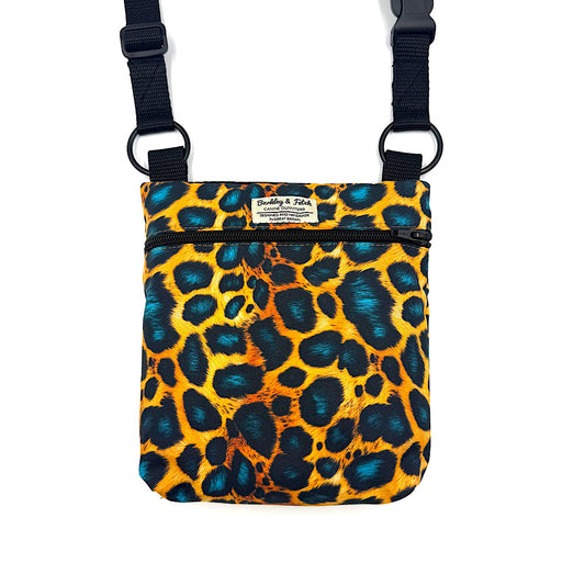 Leopard print bag with black straps on a white background. Handmade in UK by Barkley and Fetch