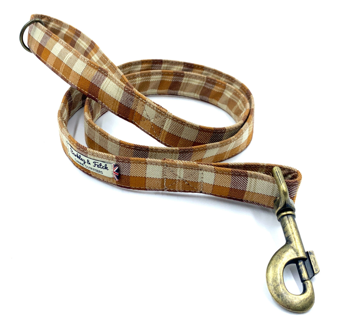 A plaid patterned dog lead with a metal trigger hook and a D-ring on the handle.