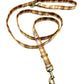 Plaid patterned dog leash on a white background