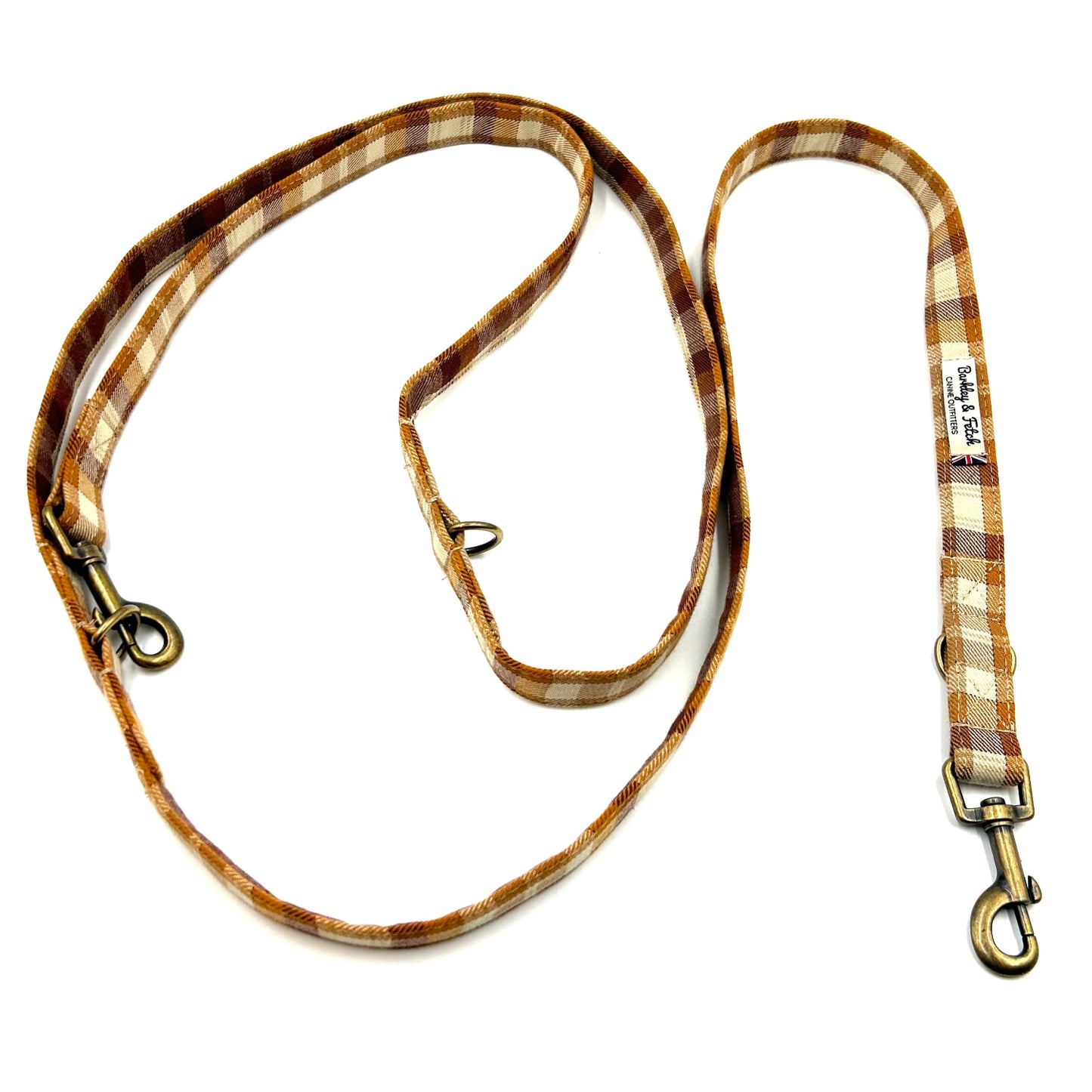 Plaid patterned dog leash on a white background