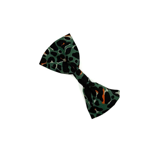 Green and black patterned bow tie on a white background