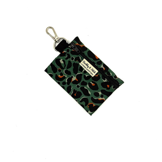 Green leopard print pouch with a keychain on a white background