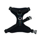 Black dog harness with plaid strap on a white background